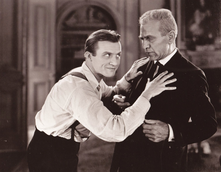 Dwight Frye as Renfield (left) and Edward Sloan as Dr. Van Helsing (right) in <i>Dracula</i> (1931)