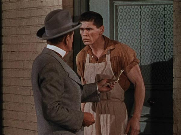 Charles Bronson (credited in the film as Charles Buchinsky) as Igor in <i>House of Wax</i> (1953)