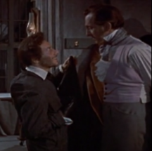 Oscar Quitak as Karl (left) and Peter Cushing as Dr. Frankenstein (right) in <i>Revenge of Frankenstein</i> (1958)