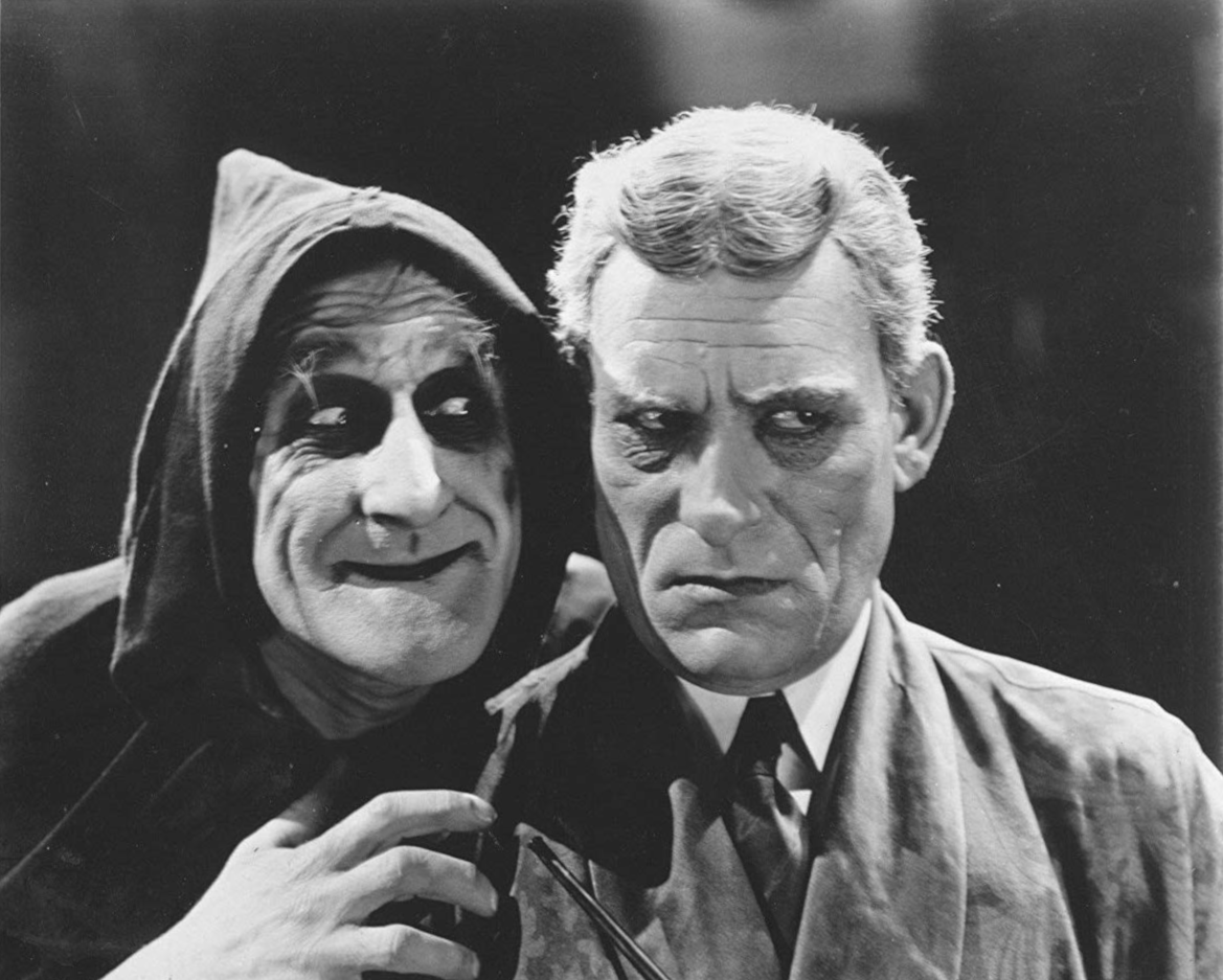 George Austin as Rigo (left) and Lon Chaney as Dr. Ziska (right) in <i>The Monster</i> (1925).